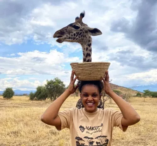 Martha Gerald Shiri 768x1024 | Shiri Adventures | Shiri Adventures Martha Gerald with a giraffe